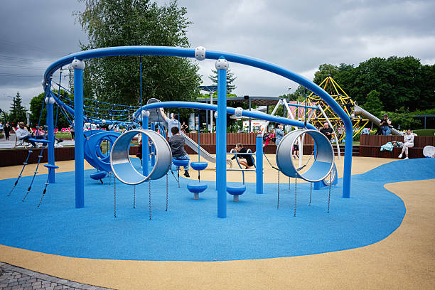 Krakow, Poland - July 08, 2025: Children enjoying a vibrant and modern playground with unique structures in Krakow, Poland