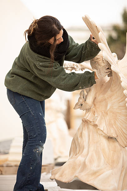Female artist restoring Renaissance angel sculptures - Buenos Aires - Argentina