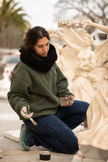 Female artist restoring Renaissance angel sculptures - Buenos Aires - Argentina