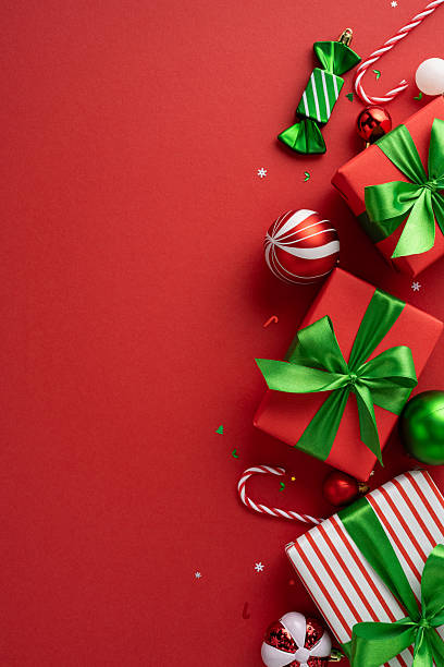 Vibrant vertical Christmas-themed image featuring beautifully wrapped presents with green ribbons and festive decorations like candy canes and ornaments