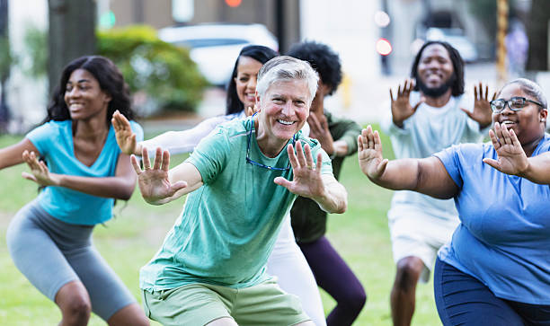 istock Senior man having fun in tai chi exercise class 2230863946