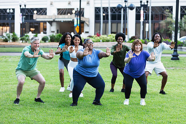 istock Multiracial group practicing tai chi in city park 2230863948