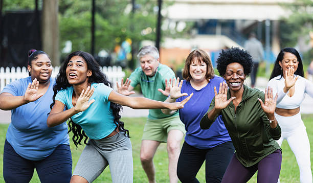istock Multiracial group practicing tai chi in city park 2230863959