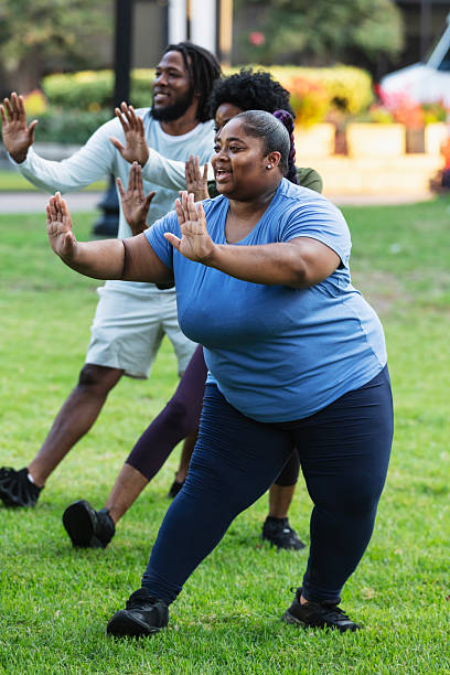 istock Young black woman practicing tai chi outdoors 2230863968