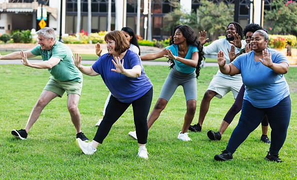 istock Multiracial group practicing tai chi in city park 2230863971