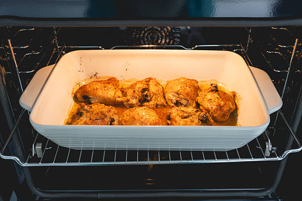 Juicy, golden-brown chicken thighs finish roasting in the oven.