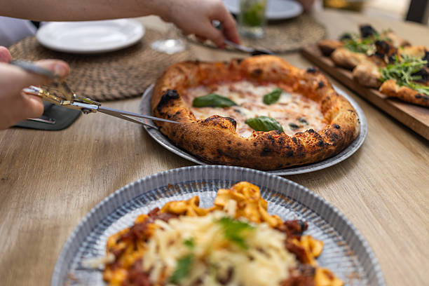 istock Serving Freshly Made Pizza and Pasta During a Meal Gathering 2230865053