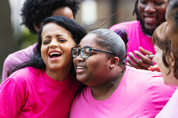istock Two women support each other at breast cancer event 2230865266