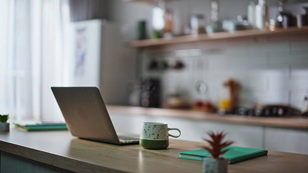 istock Organized home workspace laptop in remote kitchen office closeup. Online work 2230867176