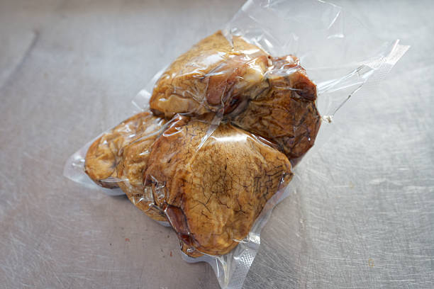 istock Smoked white chicken meat: ham, fillet, and breast in vacuum packaging 2230868343