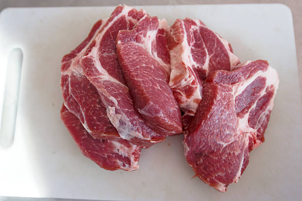 Red Meat Pork and Beef on a cutting board