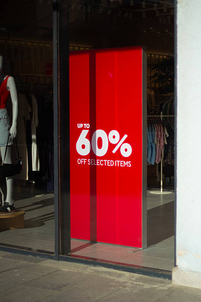 istock Vertical photo. Red banner with text up to 60 % off selected items 2230872504