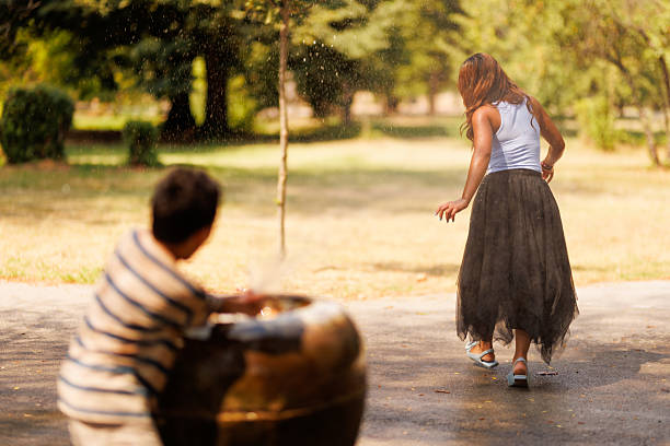 Kids playing in the Sugar Hill park fountain.