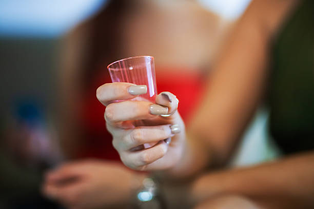 Photo of young cheerful afro girl happy positive smile party drink alcohol cocktail isolated over red color background.