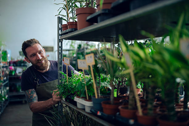 istock Male florist working in a flower store. 2230876375