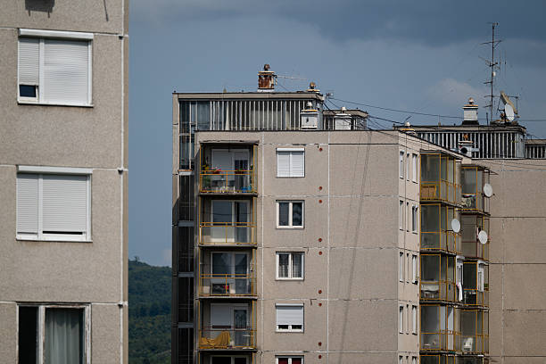istock Residential apartment building with green hillside background 2230876426