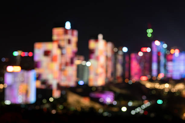 A blurred nighttime view of Shenzhen, with city lights creating a soft, abstract effect. Suitable for use as a background.