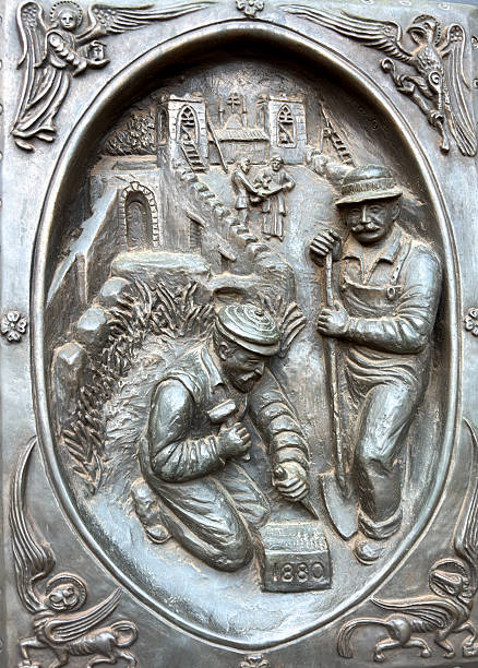 Santa Fe, NM: Panel on the bronze doors of the Cathedral Basilica of St Francis of Assisi. A block from the historic Santa Fe Plaza in New Mexico, the cathedral was built by Archbishop Lamy between 1869 and 1886 in the Romanesque Revival style.