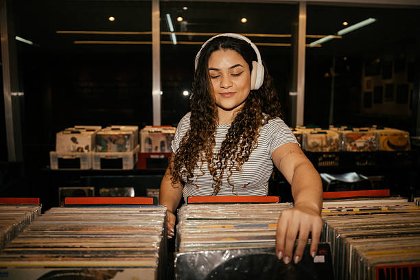 istock Girl in record store 2230888351