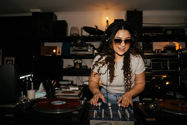 istock Young woman having fun in record store 2230888514
