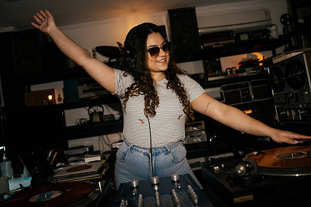 Young woman having fun in record store