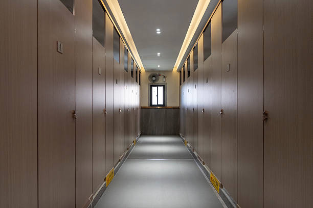 istock Modern Bathroom Interior with Wooden Panels and Recessed Lighting 2230889673