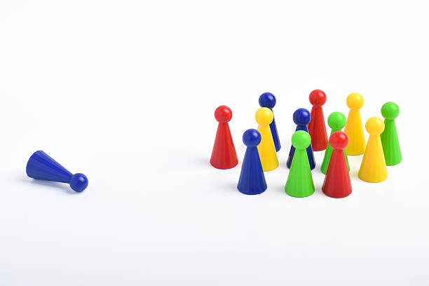 istock Blue pawn is far from the group of pawns 2230889965