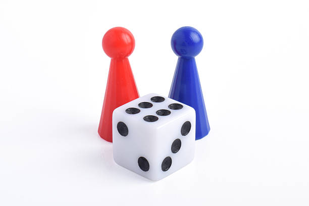 istock Blue and red board game figures and dice 2230891511