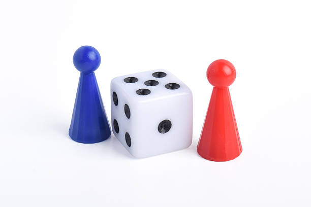 istock Blue and red board game figures and dice 2230891565