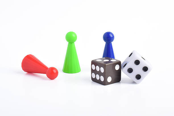 istock Colorful board game figures and dice 2230891566