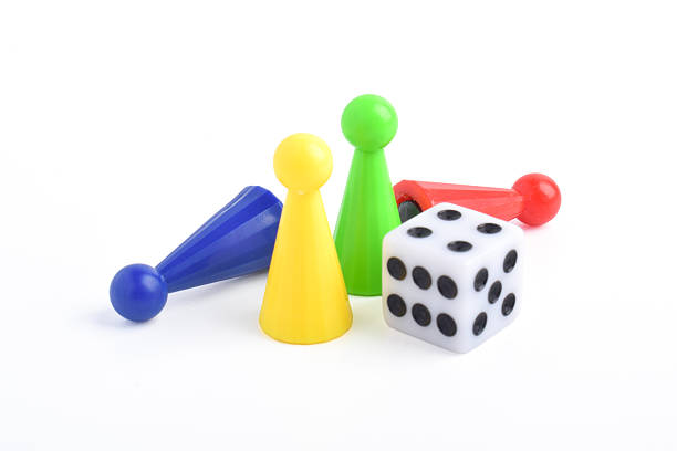 istock Colorful board game figures and dice 2230891601