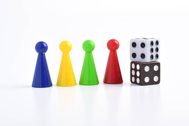 istock Colorful board game figures and dice 2230891603