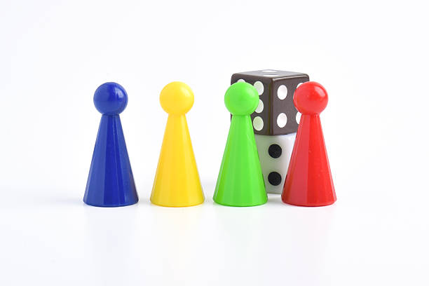 istock Colorful board game figures and dice 2230891604
