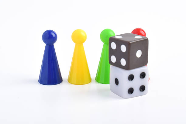 istock Colorful board game figures and dice 2230891610