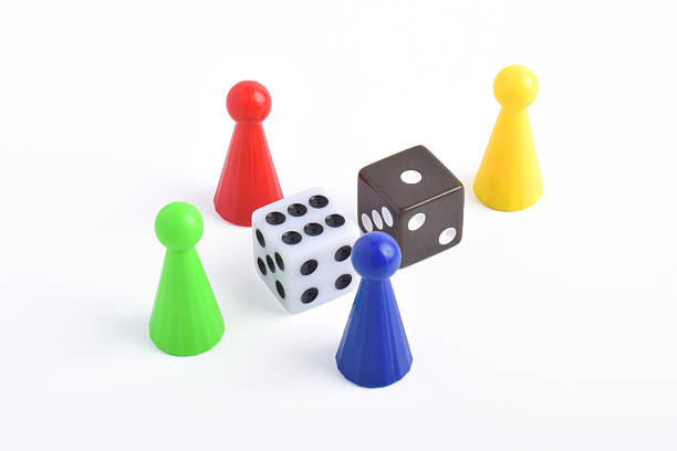 istock Colorful board game figures and dice 2230891642