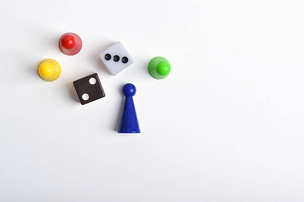 istock Colorful board game figures and dice on white background 2230891824