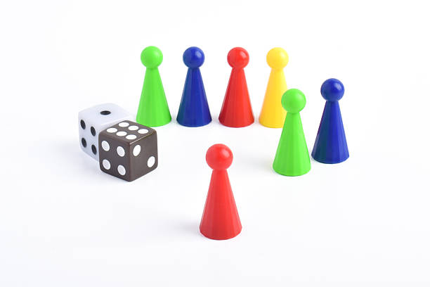 istock Colorful board game figures and dice 2230891836