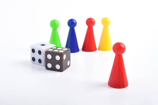 istock Colorful board game figures and dice 2230891847