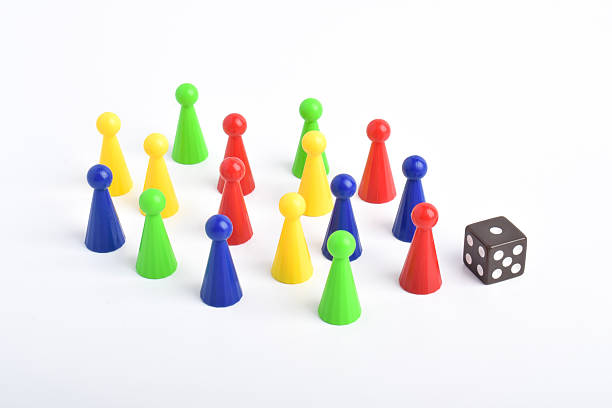 istock Colorful board game figures and dice 2230891871