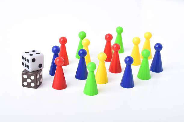 istock Colorful board game figures and dice 2230891887