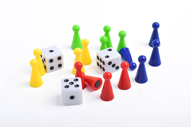 istock Colorful board game figures and dice 2230891897