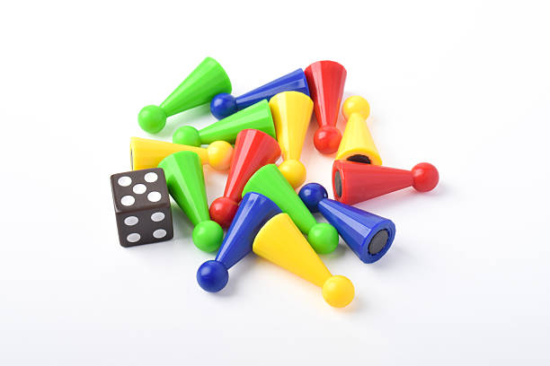 istock Colorful board game figures and dice 2230891909