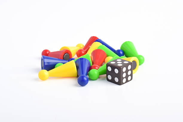 istock Colorful board game figures and dice 2230891918