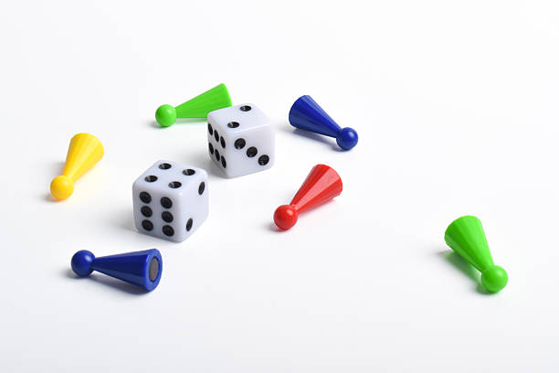 istock Colorful board game figures and dice 2230891930