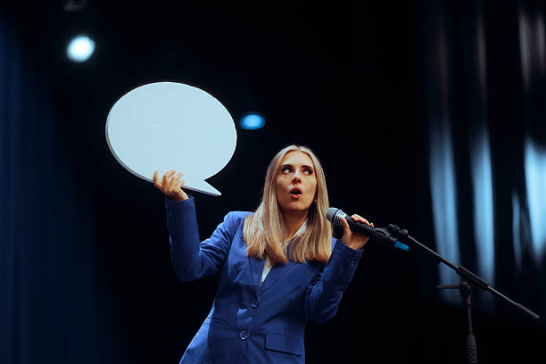 istock Business Woman Holding a Speech Bubble Making a Presentation 2230891954