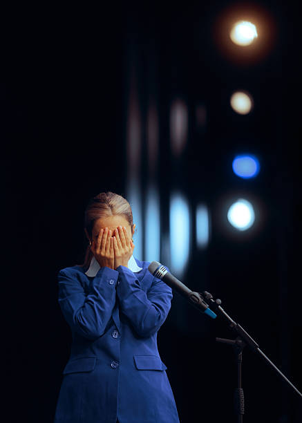 Businesswoman feeling pressure and fear of speaking in public