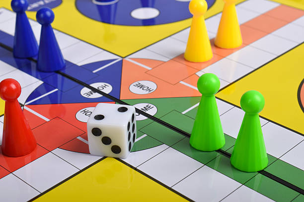 istock Ludo game board with figures and dice 2230892384