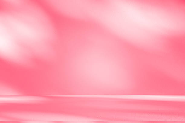 istock Wall interior background, studio, and backdrops show products. with shadow from window color white and pink light. background for text insertion and presentation of product 2230894884