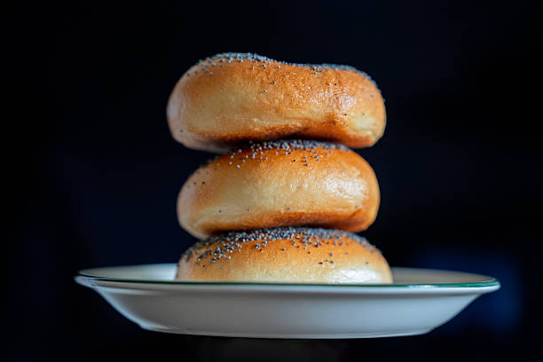 istock Stack of Poppy Seed Bagels on a Plate 2230895032