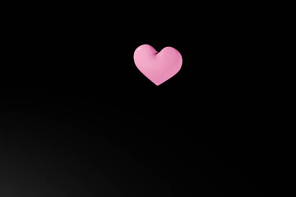 Pink heart symbol on a black background